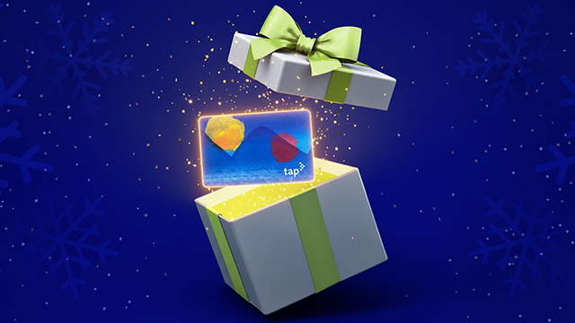 A wrapped gift box opens to reveal a TAP card