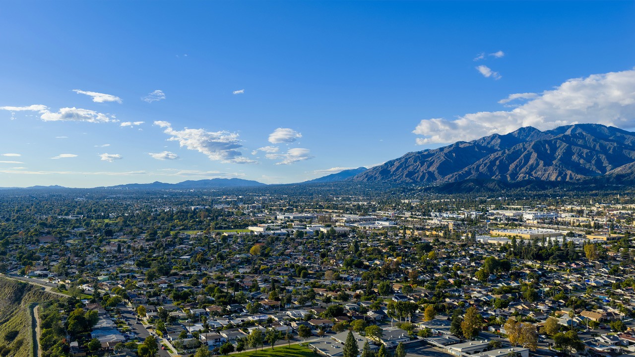 San Gabriel Valley foothills, valley, and blue sky with some white clouds