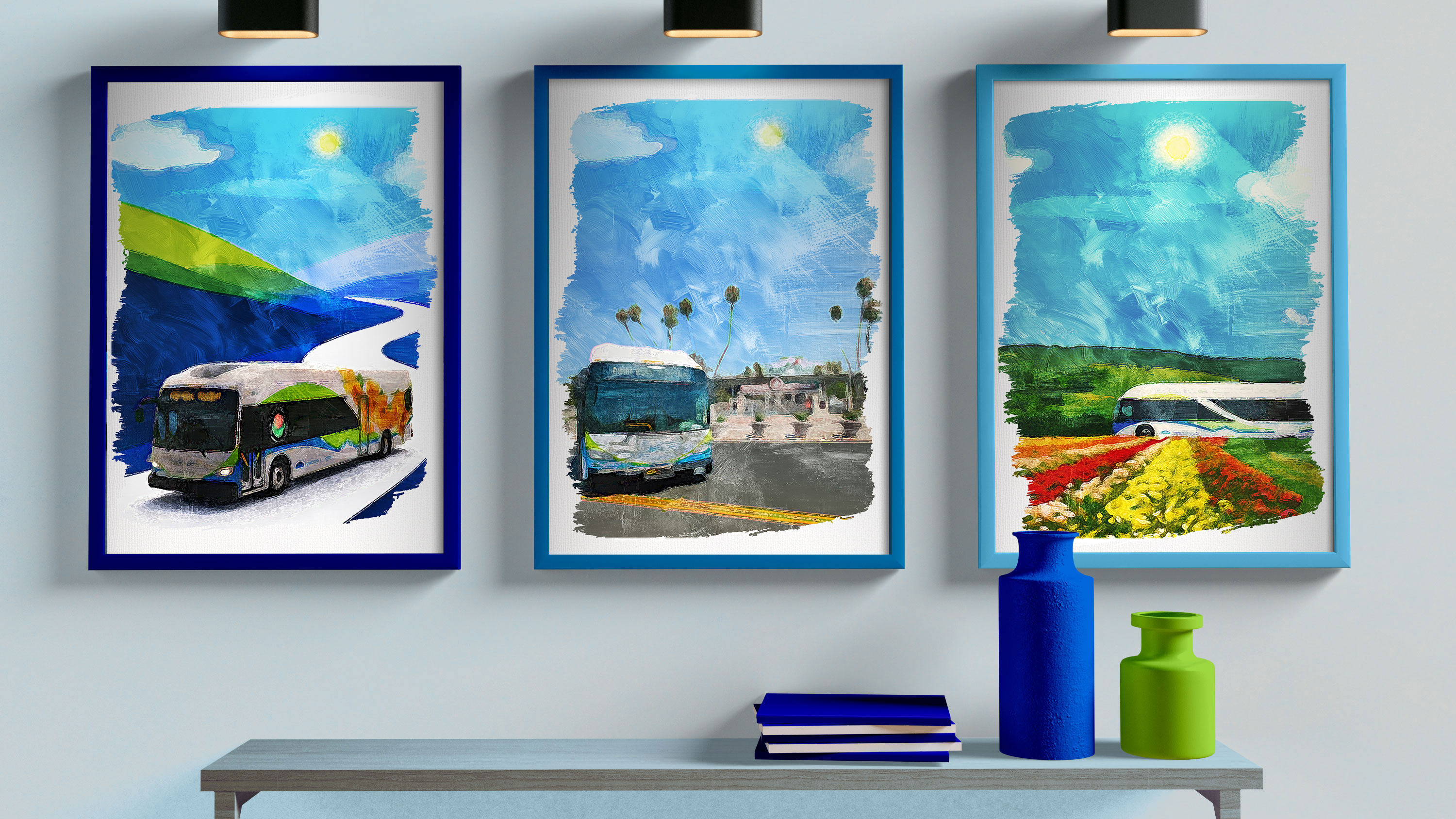 framed artistic graphics of Foothill Transit buses on a wall under lights and over a shelf with books and vases