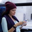 A customer reads a book on the bus