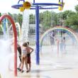 children play at a splash pad
