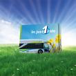 a field with a large an allergy medication box showing a Foothill Transit bus, daffodils, and the words "In just 1 ride"