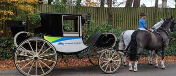 a horse drawn carriage with Foothill Transit livery