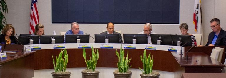 Board members in conference room