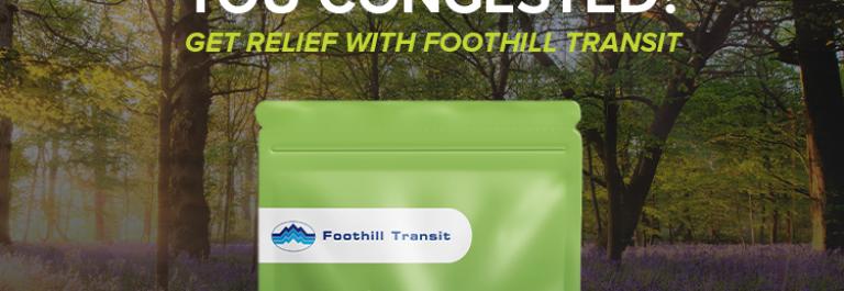 an image of a green pouch and blue wrapped lozenges with the Foothill Transit logo on a background of a forest with the text TRAFFIC GOT YOU CONGESTED? GET RELIEF WITH FOOTHILL TRANSIT