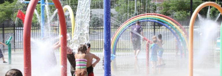 children play at a splash pad