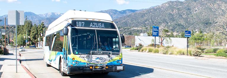 a Line 187 bus leaving Duarte with the foothills in the background