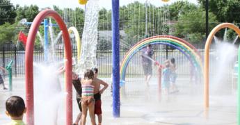children play at a splash pad