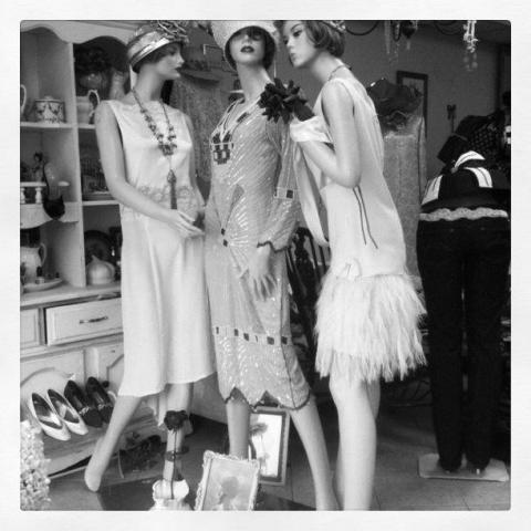 3 mannequins dressed in vintage fashions